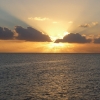 Sun sets over a calm sea